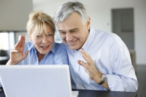 16397524 - senior couple connected with family on internet